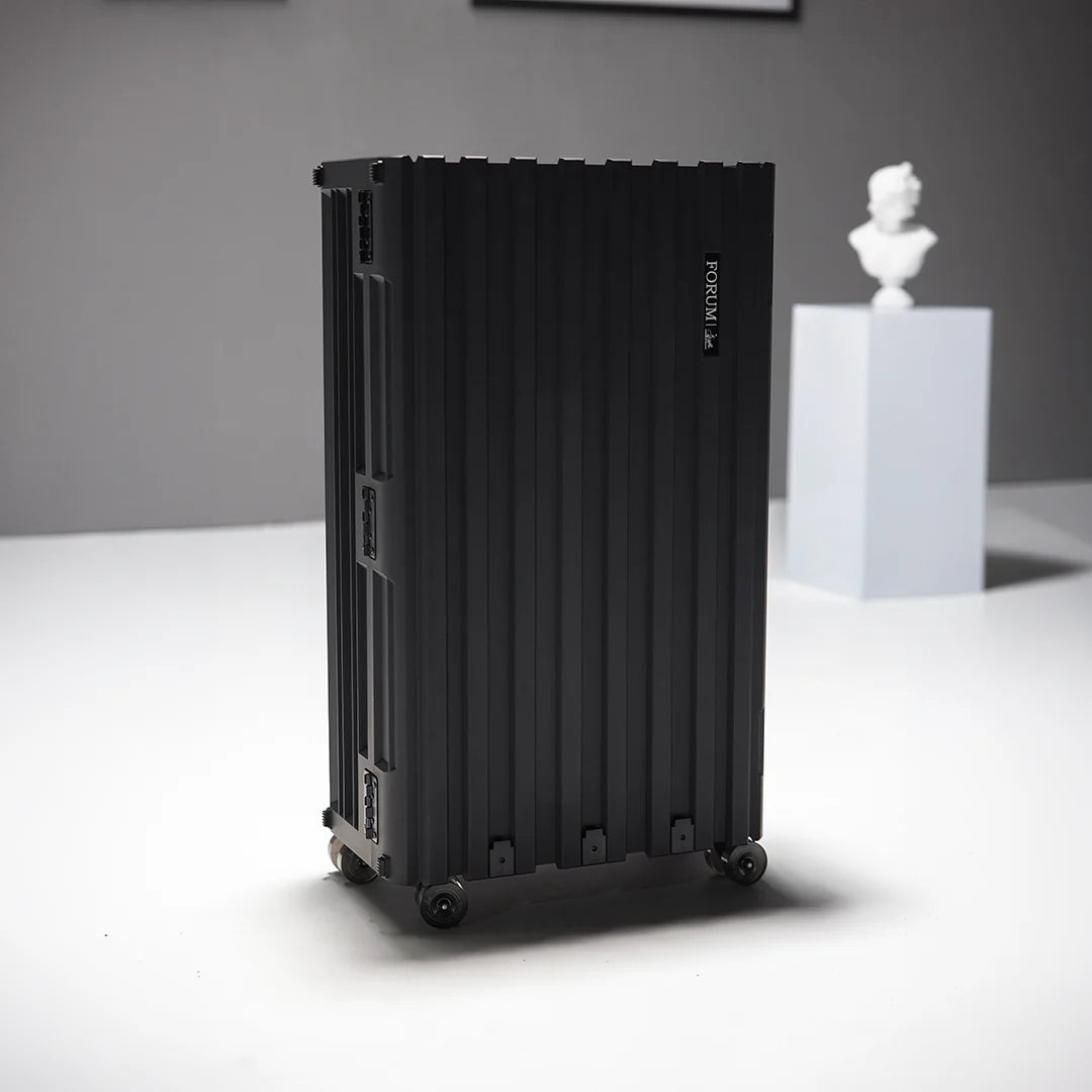 The Hades case standing in a white studio beside a classical bust