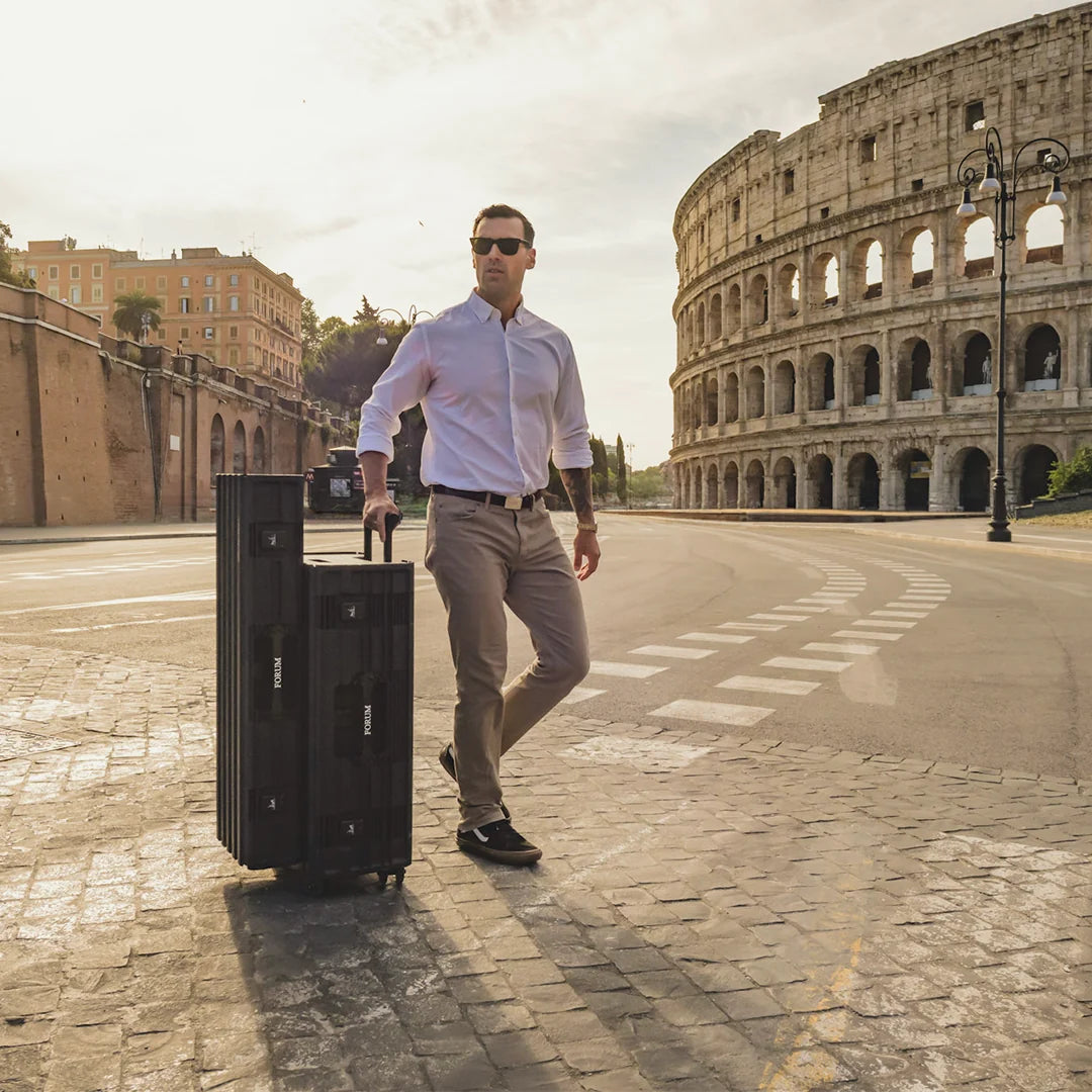 A man wheels the Chariot Bundle past the Colosseum