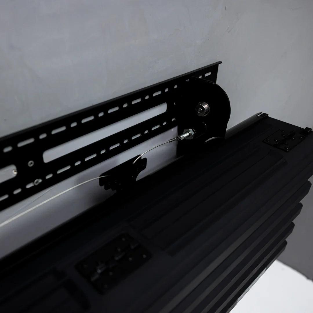 The Wall Mount's steel rail and pivot, a steel cable running to the case